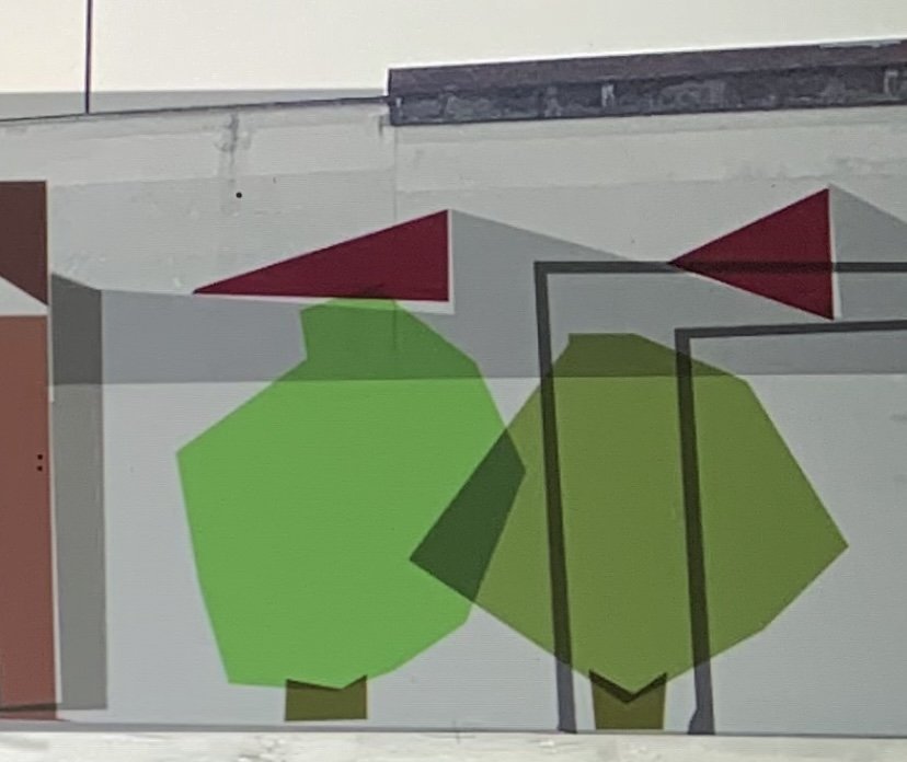 Studio del muro con due alberi stilizzati verdi e bandiere rosso scuro